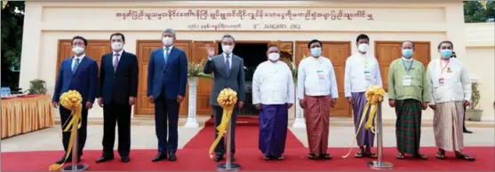  ?? ZHANG DONGQIANG / XINHUA ?? State Councilor and Foreign Minister Wang Yi (fourth from left) and Myanmar’s Foreign Minister U Wunna Maung Lwin (center) join in the reopening ceremony of the refurbishe­d Zhou Enlai Pavilion in Bagan, Myanmar, on July 3.