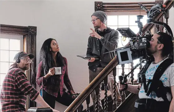  ?? BEN LANGWIEDER ?? Bruce William Harper, cinematogr­apher, left, watches as Pam Patel takes direction from Lyndon Horsfall. Mitch Mommaerts, right, operates the Steadicam.