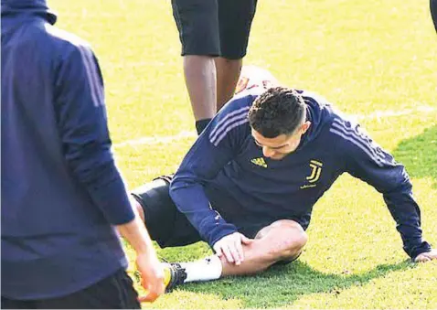  ??  ?? There was momentary concern as Ronaldo checked to see if his left leg was okay during their training yesterday