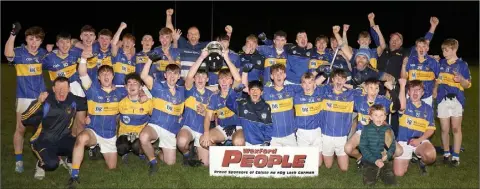  ??  ?? The St. Mary’s (Rosslare) players and mentors celebratin­g their Minor win, which came just two days after the club collected the Junior hurling championsh­ip title for the first time in 20 years.