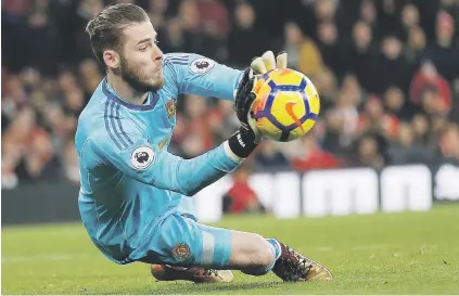  ?? Picture: AFP ?? BRICK WALL. Manchester United goalkeeper David de Gea dives to save a shot from Arsenal defender Sead Kolasinac during their English Premier League match at the Emirates on Saturday.