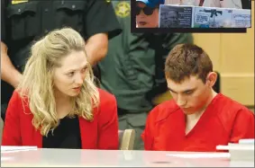  ?? Associated Press photos ?? Nikolas Cruz appears in court for a status hearing before Broward Circuit Judge Elizabeth Scherer in Fort Lauderdale, Fla., Monday. Cruz is charged with killing 17 people and wounding many others in Wednesday’s attack at Marjory Stoneman Douglas High School in Parkland, which he once attended. In top photo, Heidi Ferrer carries a sign and joins protesters against gun violence in Pershing Square in downtown Los Angeles on Monday.