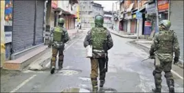  ?? ANI ?? CRPF personnel patrol a street during a strike called by a local traders’ body in Srinagar on Sunday. ■