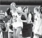  ?? Danny Moloshok Associated Press ?? MONIQUE BILLINGS, left, and Coach Cori Close celebrate after the Bruins defeated Boise State.