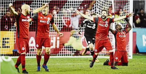  ?? — AP ?? We’ve done it: Toronto players celebratin­g after defeating Seattle Sounders in the MLS Cup final on Saturday.