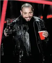  ?? CHRIS PIZZELLO/INVISION ?? Post Malone accepts the top artist award at the Billboard Music Awards on Wednesday in Los Angeles.