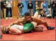  ?? SHARON HOLY — THE NEWS-HERALD ?? Lake Catholic’s Kevon Freeman competes during the Division II Alliance District on March 3.