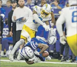  ?? ZACH BOLINGER Associated Press ?? CHARGERS safety Derwin James Jr. was ejected for this hit on Colts receiver Ashton Dulin last season. Roughness penalties have plagued James this season.