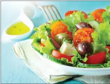  ?? DREAMSTIME/ TNS ?? Lettuce and tomato is a good start for any salad. But what really makes a salad a salad is the dressing.