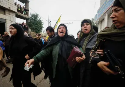  ?? ?? A relative mourns during the funeral of Palestinia­n Mufeed Iklayel near Hebron in the Israeli-occupied West Bank on Tuesday. —reuters