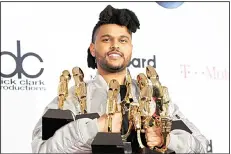  ?? (AFP) ?? The Weeknd poses with his awards.