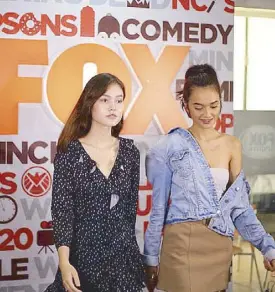  ??  ?? Adela and Jachin show some catwalk moves before media interviews at the FOX office at Bonifacio Global City