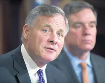  ?? Shawn Thew European Pressphoto Agency ?? “THE ISSUE of collusion is still open,” said Sen. Richard M. Burr, left, shown with Sen. Mark R. Warner.