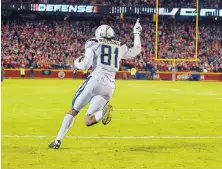  ?? ED ZURGA/ASSOCIATED PRESS ?? Chargers wide receiver Mike Williams celebrates after scoring the winning points on a 2-point conversion pass in the final seconds to secure LA’s comeback win over Kansas City.