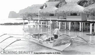 ??  ?? A man delivers supplies in El Nido
CALMING BEAUTY
PHOTO BY FATIMA CIELO CANCEL