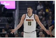  ?? GODOFREDO A. VÁSQUEZ — THE ASSOCIATED PRESS ?? Nuggets center Nikola Jokic reacts during the first half of Sunday’s game against the Warriors in San Francisco.