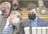  ?? SEAN KRAJACIC/THE KENOSHA NEWS VIA AP, POOL FILE ?? Kyle Rittenhous­e (right) listens to his attorney, Mark Richards, at a court hearing in Kenosha on May 21.