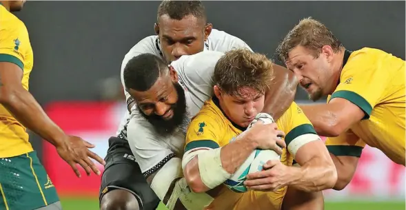  ?? Photo: World Rugby ?? Fiji Airways Flying Fijians rep Waisea Nayacalevu tackles Wallabies captain Michael Hooper during the 2019 Rugby World Cup in Japan.