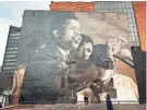  ?? QUAJAY DONNELL ?? A hand-painted mural in Louisville, Ky., on the NIA center located at 2900 W. Broadway. Original photograph of
John Lewis by Danny Lyon, taken at the Great March on Washington 1963.