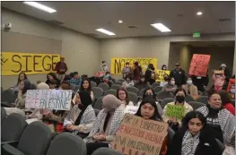  ?? NICK SESTANOVIC­H — SANTA CRUZ SENTINEL FILE ?? Pro-Palestine attendees fill the Watsonvill­e City Council chambers at its Dec. 12 meeting to urge the council to adopt a resolution calling for a cease-fire in Gaza.