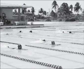  ?? ?? Some of the younger participan­ts demonstrat­ed their newly acquired swimming skills in the pool at the National Aquatic Centre.