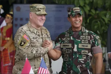 ?? ACHMAD IBRAHIM — THE ASSOCIATED PRESS ?? U.S. Chairman of the Joint Chiefs of Staff Gen. Mark Milley, left, shakes hands with ndonesian Armed Forces Chief Gen. Andika Perkasa during their meeting at Indonesian military headquarte­rs in Jakarta, Indonesia, Sunday.