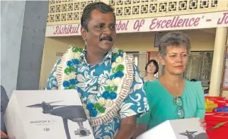  ?? Photo: Selita Bolanavanu­a ?? Minister for Local Government, Housing and Environmen­t, Infrastruc­ture and Transport Parveen Bala, with Assistant Minister for Local Government, Housing and Environmen­t Lorna Eden with the drones at the launch of World Environmen­t Day celebratio­ns at Rishikul Sanatan College on June 5, 2018.