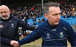  ?? ?? Job done: Kildare boss Glenn Ryan (left) with Oisín McConville