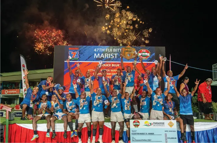  ?? Photo: Leon Lord. ?? Police Blue rugby players and officials celebrate winning the 47th Fiji Bitter Marist Sevens tournament at the HFC Bank Stadium in Suva on March 17, 2023. Police Blue beat Fiji One 15-5 in the Cup final.