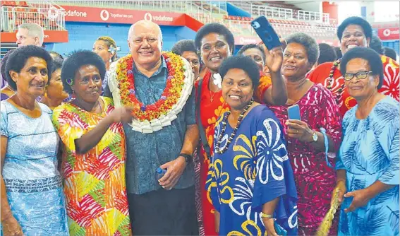  ?? Picture: RUSIATE VUNIREWA ?? Deputy Prime Minister and Minister for Education, Tourism and Civil Aviation Viliame Gavoka with women at the Vodafone Arena last week.