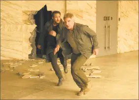  ?? Stephen Vaughan / Associated Press ?? Ryan Gosling, left, and Harrison Ford in a scene from “Blade Runner 2049.”