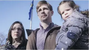  ?? JEFF MCINTOSH/THE CANADIAN PRESS ?? Edouard Maurice, seen here with his daughter Teal and wife Jessica, faces charges after shots were fired on their rural property when Maurice allegedly found two people rooting though his vehicle. The case has been put over until May 4.