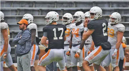  ?? STAFF FILE PHOTOS BY DAVID COBB ?? Tennessee quarterbac­ks Will McBride (17) and Jarrett Guarantano (2) work through a drill before a scrimmage at Neyland Stadium on April 7. After two scrimmages in front of more exclusive groups this spring, the Vols’ Orange and White spring game is...