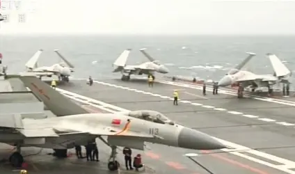  ?? (CCTV VIA AP VIDEO) ?? J-15 FIGHTER JETS taxi on China’s aircraft carrier Liaoning as they prepare to conduct a drill in the South China Sea. China confirmed that its aircraft carrier has for the first time conducted drills in the South China Sea.