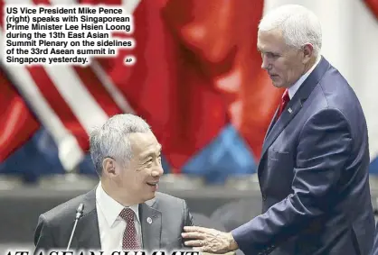  ?? AP ?? US Vice President Mike Pence (right) speaks with Singaporea­n Prime Minister Lee Hsien Loong during the 13th East Asian Summit Plenary on the sidelines of the 33rd Asean summit in Singapore yesterday.