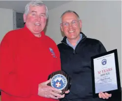  ??  ?? Ian Hurst (left) receiving a 50 years long service award in 2013 from Peak District Mountain Rescue president David Coleman