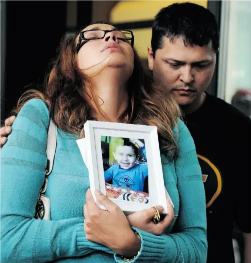  ?? Bruce Edwards/ Edmonton Journal ?? Sage Morin, left, mother of Geo Mounsef who was killed in the restaurant patio crash on Sunday, stands with her brother Jason Quinney outside the courthouse Friday, where she reacts after bail was granted to Richard Suter, the man charged in the boy’s...