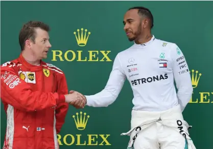  ?? FOTO: AFP-LEHTIKUVA/KIRILL KUDRYAVTSE­V ?? De två bästa – Kimi Räikkönen och Lewis Hamilton.