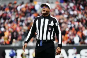  ?? AP PHOTO/MATT ROURKE ?? Referee Ronald Torbert umpires during a Jan. 8 NFL football game between the Cincinnati Bengals and Baltimore Ravens in Cincinnati.