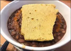  ?? Arkansas Democrat-Gazette/JENNIFER CHRISTMAN ?? Sweet cornbread atop the Arkansas Hot Tamale bowl is shaped like the state at TAE.