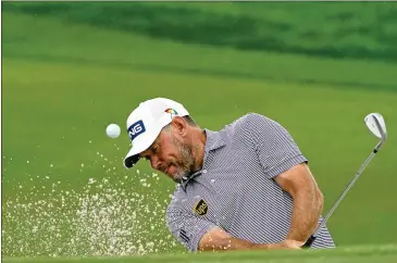  ?? JOHN RAOUX/AP ?? Lee Westwood, 47, hits a shot from a sand trap on the second hole during the third round of the Arnold Palmer Invitation­al Saturday at Bay Hill in Orlando, Florida.