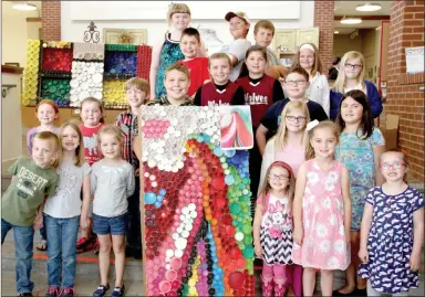  ??  ?? Most of the students involved in a new after school art program showed up during a reception held May 22 at Lincoln Public Library. The students’ works of art were on display all week at the library. They’ve been meeting after school once a week for 16...