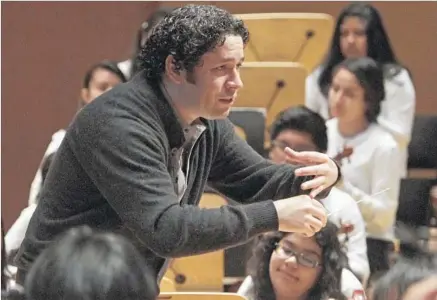  ?? Lawrence K. Ho Los Angeles Times ?? GUSTAVO DUDAMEL leads Youth Orchestra Los Angeles at a rehearsal in 2014. YOLA is modeled after Venezuela’s El Sistema.