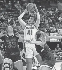  ?? GERRY BROOME/AP ?? North Carolina State center Camille Hobby shoots against Saint Mary’s forward Ali Bamberger, left, on Sunday in Raleigh, N.C.