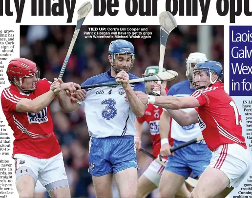  ??  ?? TIED UP: Cork’s Bill Cooper and Patrick Horgan will have to get to grips with Waterford’s Michael Walsh again