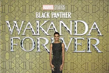  ?? /Reuters ?? Moment of glory: Cast member Letitia Wright basks in the limelight at the premiere in London of ‘Black Panther: Wakanda Forever’, which rang up $330m globally at its weekend debut, according to Walt Disney.