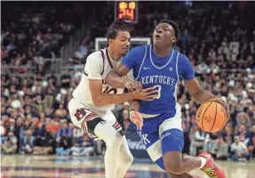  ?? JAKE CRANDALL/MONTGOMERY ADVERTISER ?? Kentucky guard Adou Thiero drives the ball on Auburn forward Chad Baker-Mazara during their game Saturday.