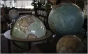  ?? KIN CHEUNG — THE ASSOCIATED PRESS ?? Various size of globes are displayed at Bellerby & Co. Globemaker­s in London.