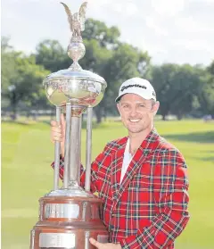  ?? AFP ?? Justin Rose of England poses with the trophy.