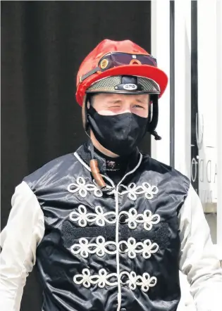  ?? PICTURE: Alan Crowhurst/getty Images ?? Jason Watson makes his way to the parade ring before riding One Day to win The British Stallion Studs EBF Novice Median Auction Stakes at Bath yesterday